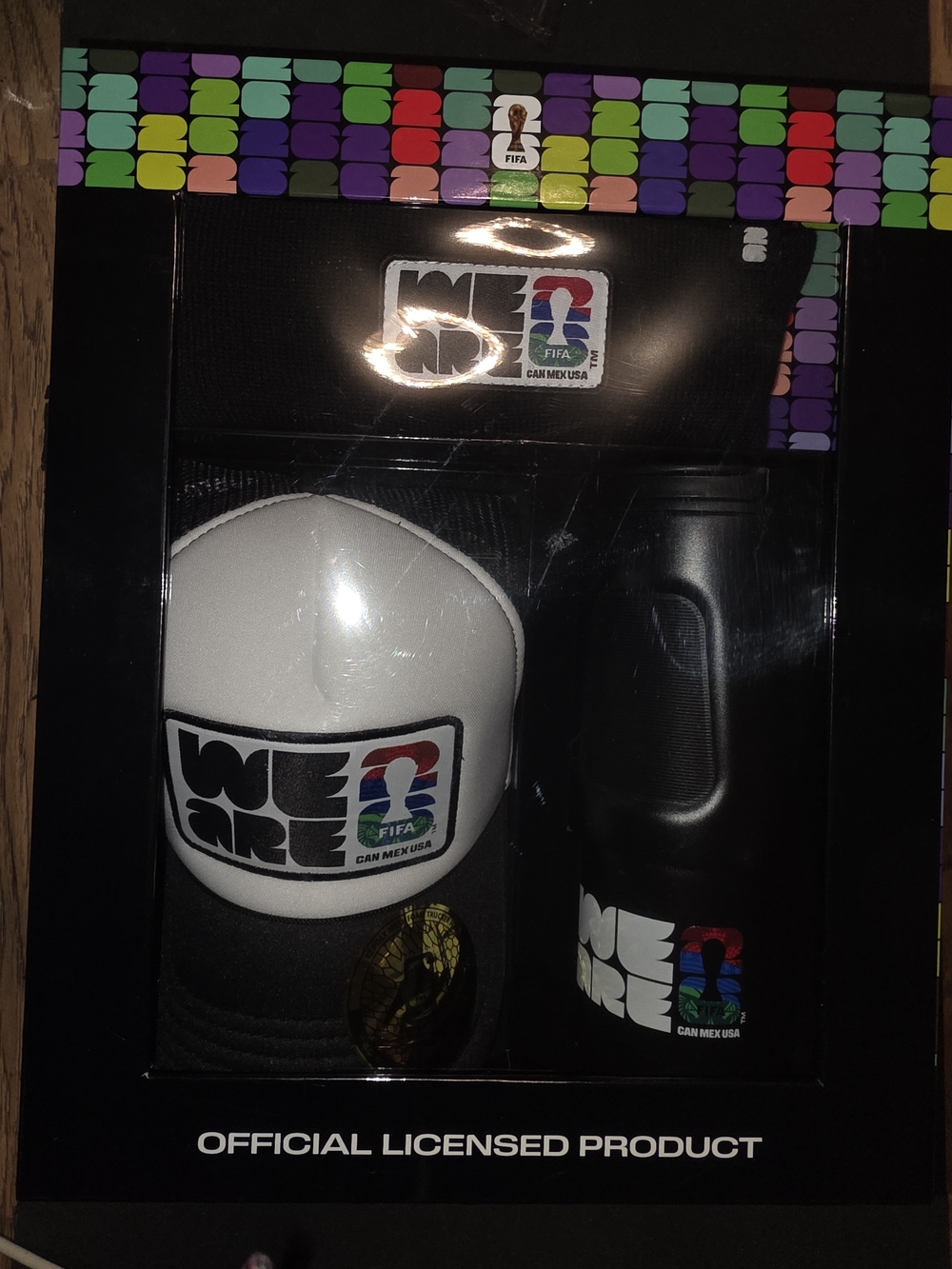 'We Are' White & Black Trucker Hat with Black Bottle - Official Licensed